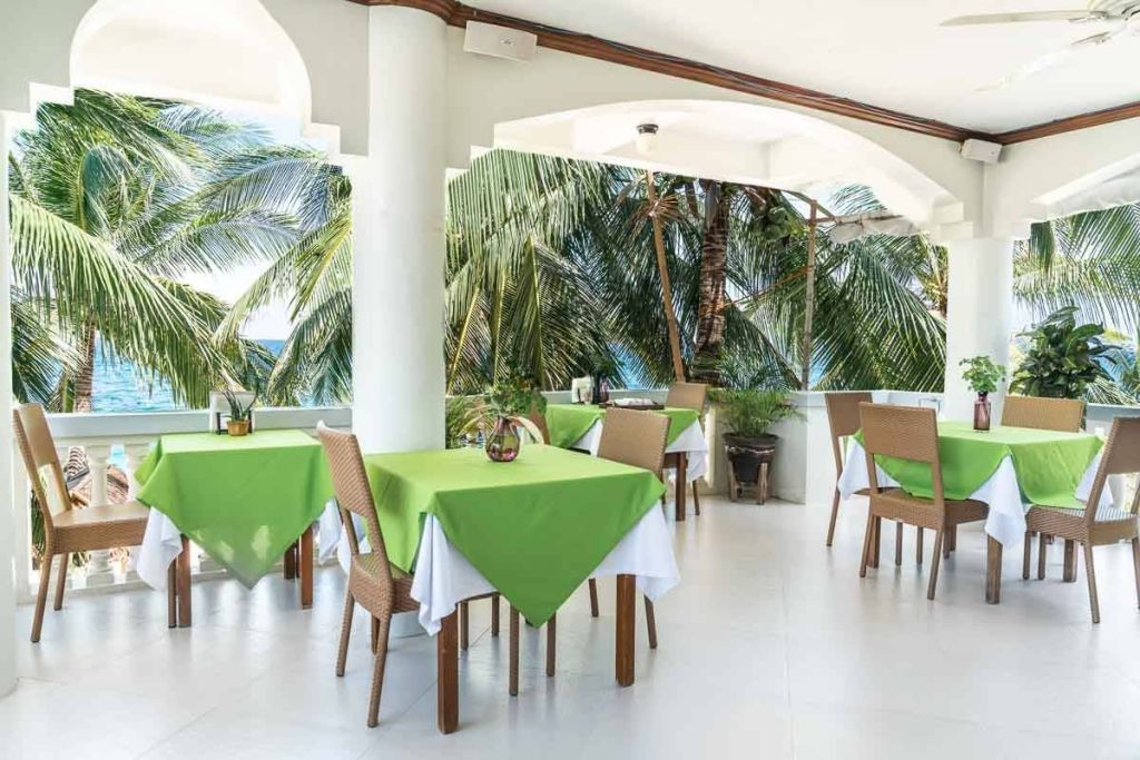 The open-air balcony restaurant overlooking the sea
