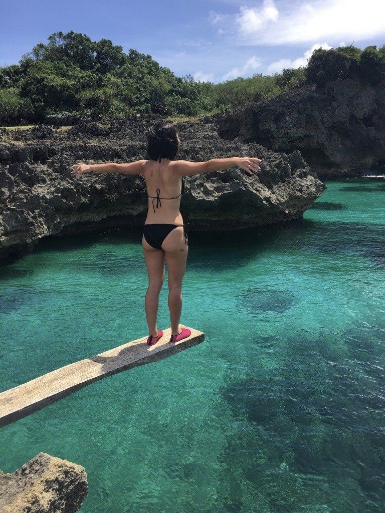 Jumping into a clear lagoon