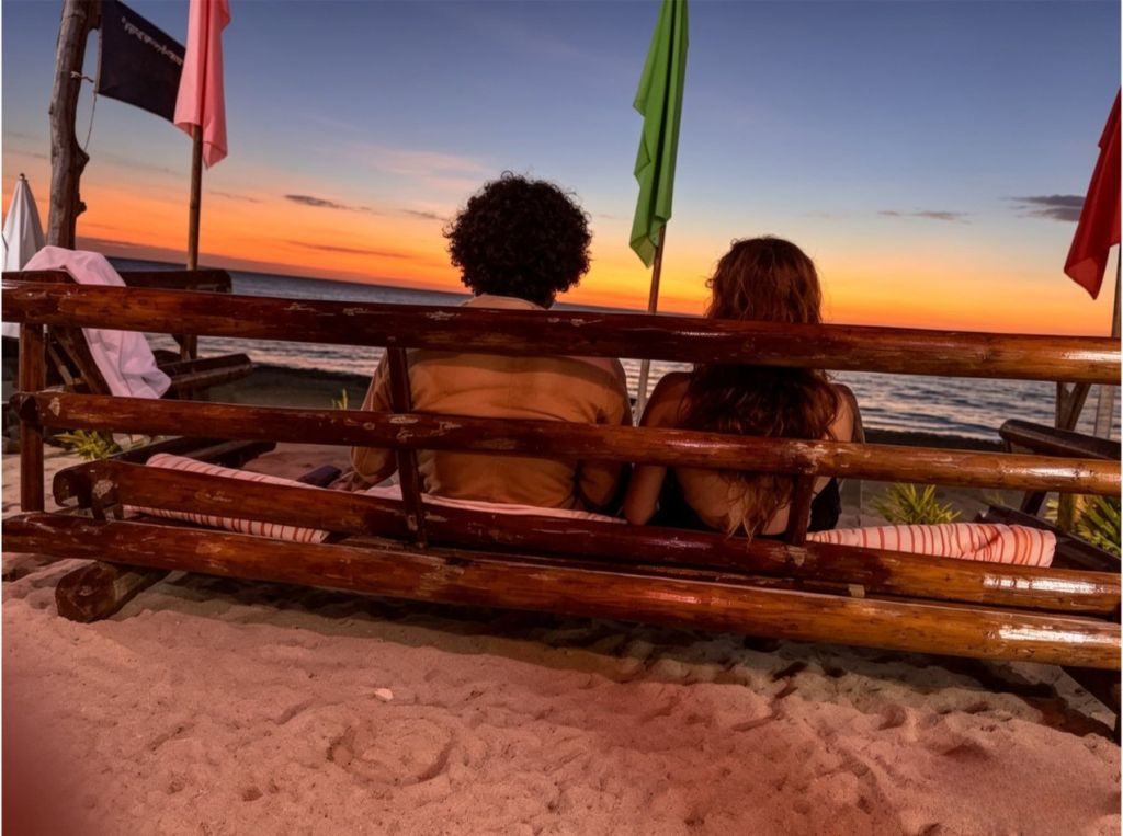 Watching the sunset from the beach bench