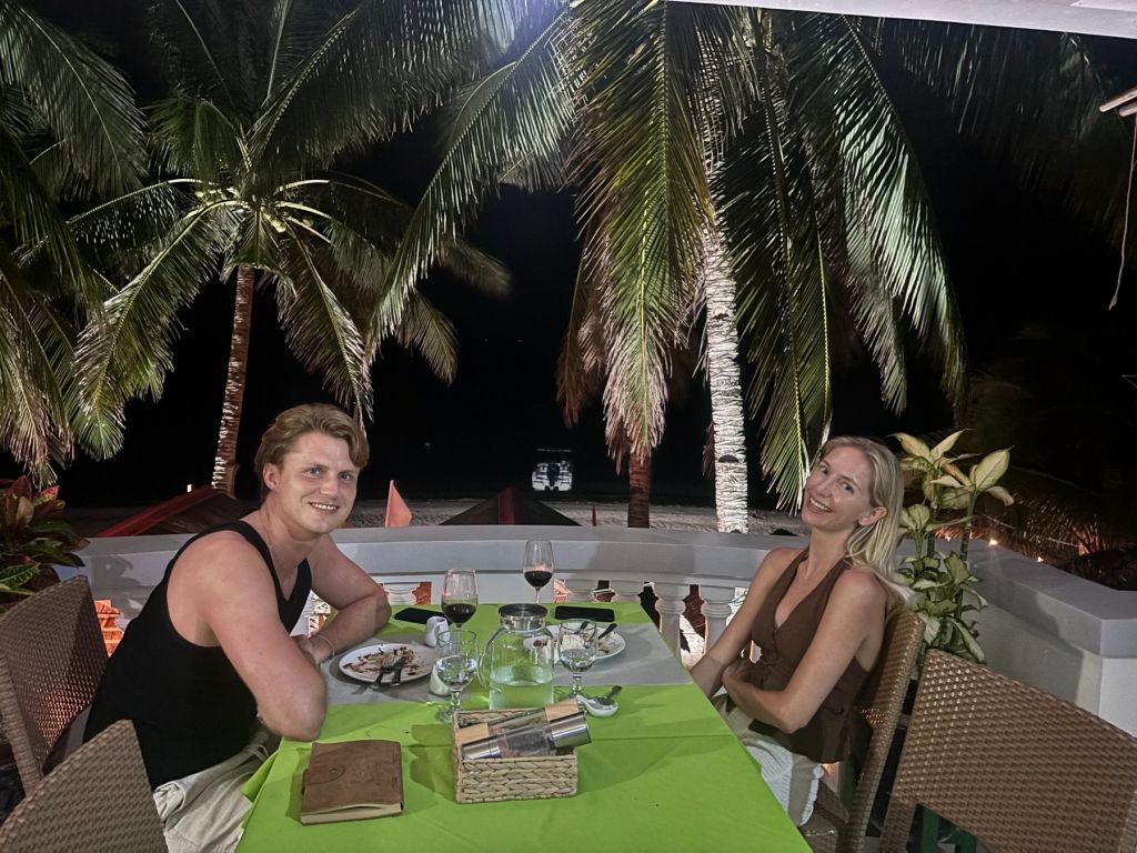 Guests enjoying dinner on the beach terrace