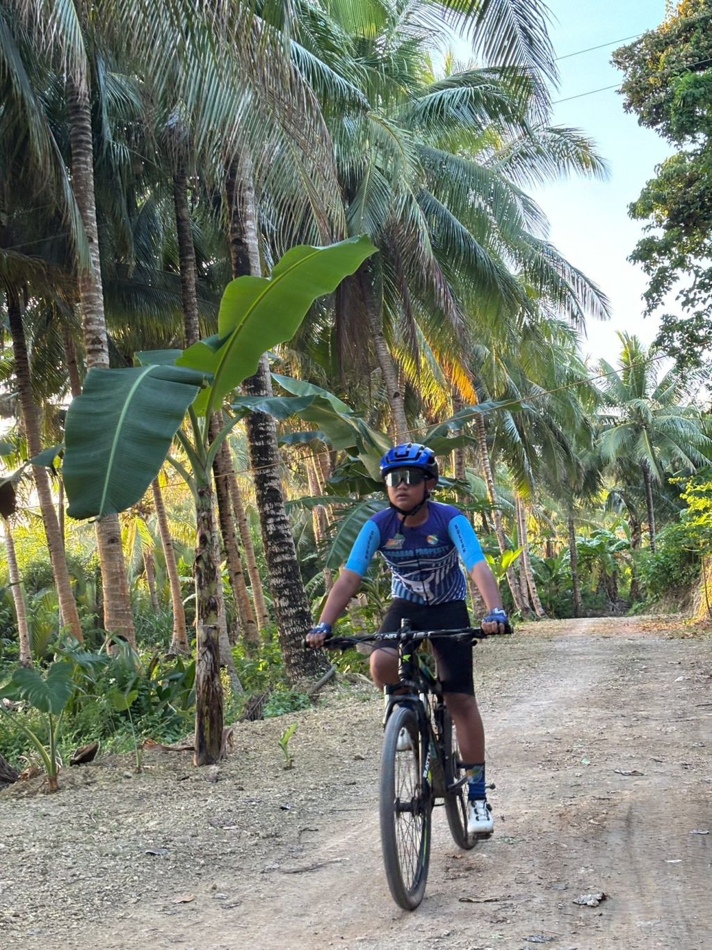 Cycling a jungle track on the island