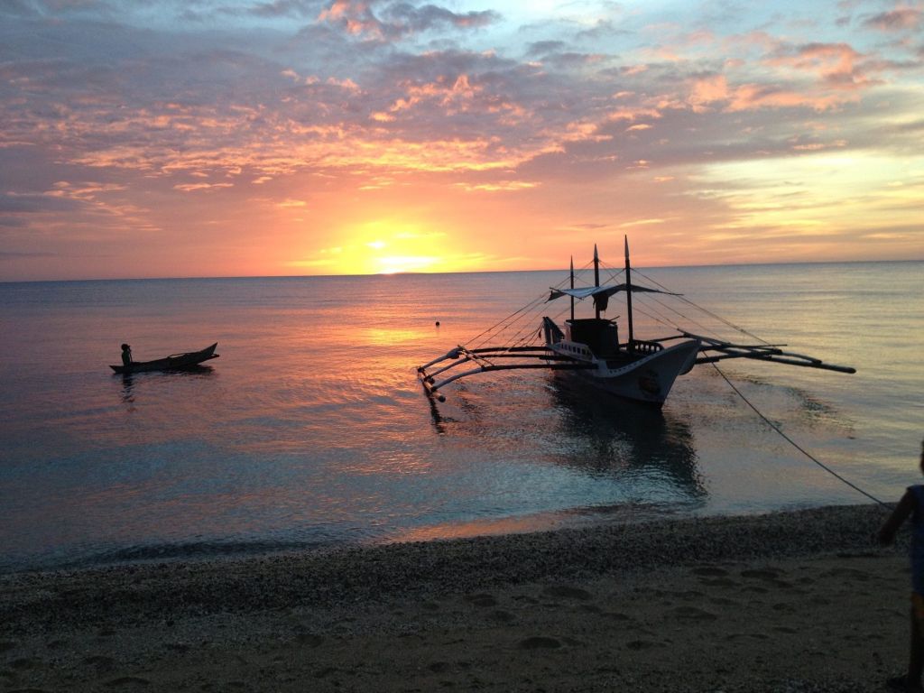 A bangka at anchor at sunset