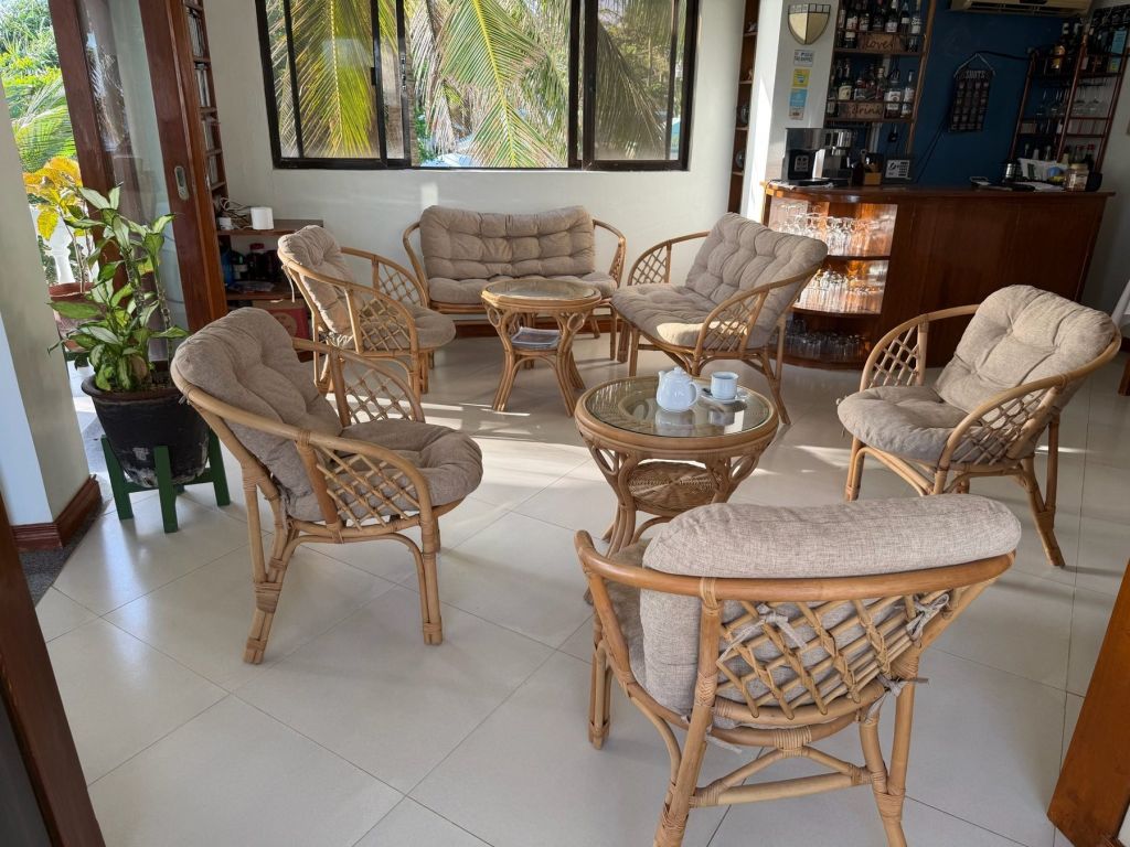 Rattan armchairs in the quiet first-floor bar and café