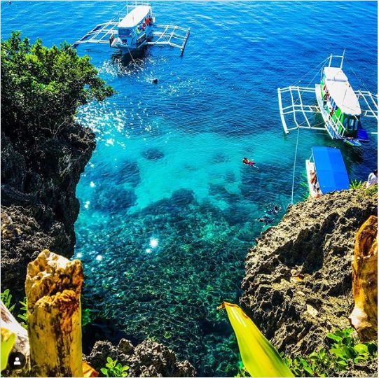 Crystal-clear water in a rocky cove
