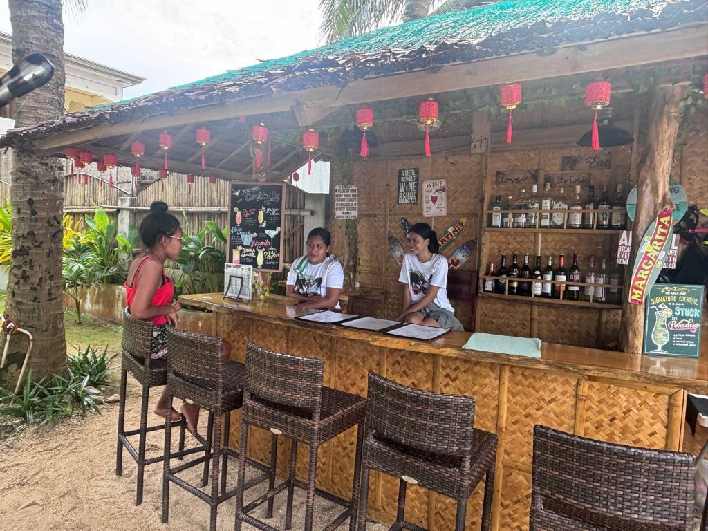 Staff behind the Tiki Beach Bar