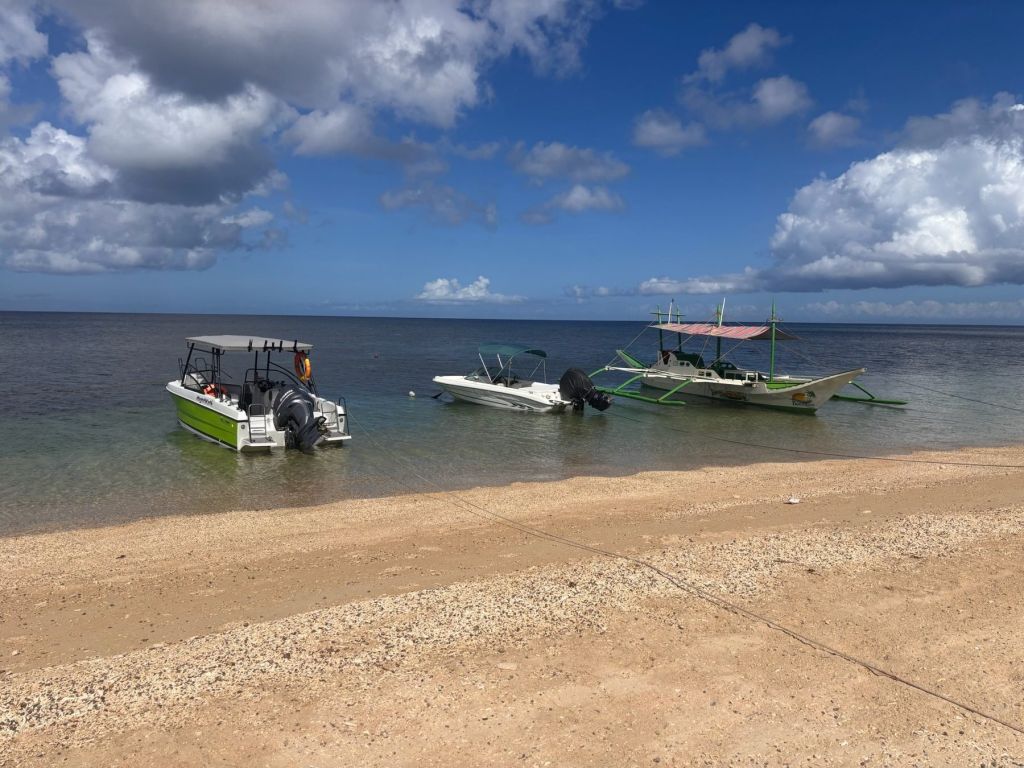 Our speedboats and bangka moored off the beach