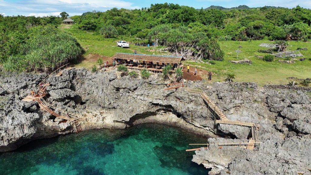 The jungle cliff and lagoon from above
