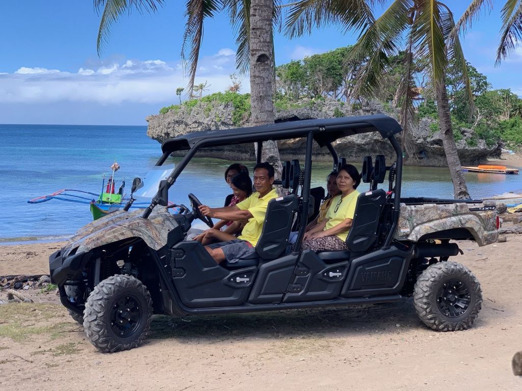Guests in our UTV on the beach